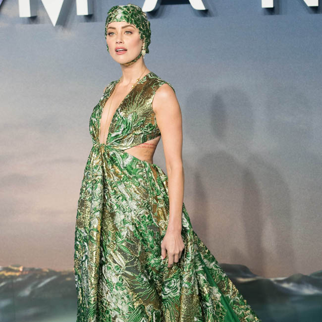 Amber wears Valentino haute couture swimming cap to Aquaman premiere