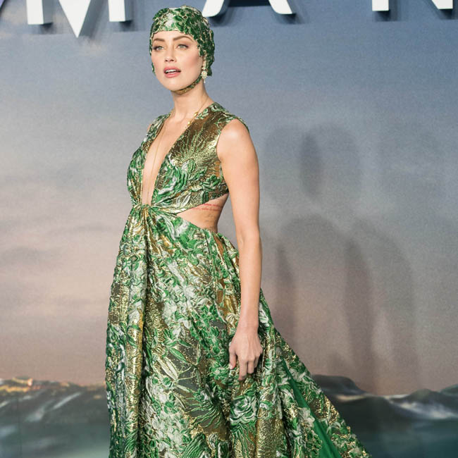 Amber Wears Valentino Haute Couture Swimming Cap To Aquaman Premiere