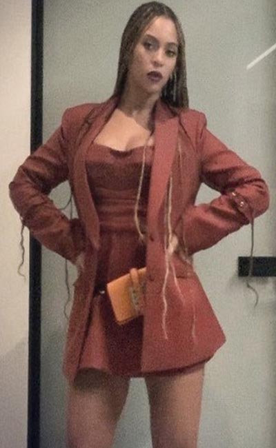 Beyonce poses in Burgundy blazer, top and mini skirt (Instagram) 2018